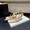 New European and American sexy thin heel rivet high heels women's one-word buckle pointed sandals women's wedding shoes medium heel single shoes