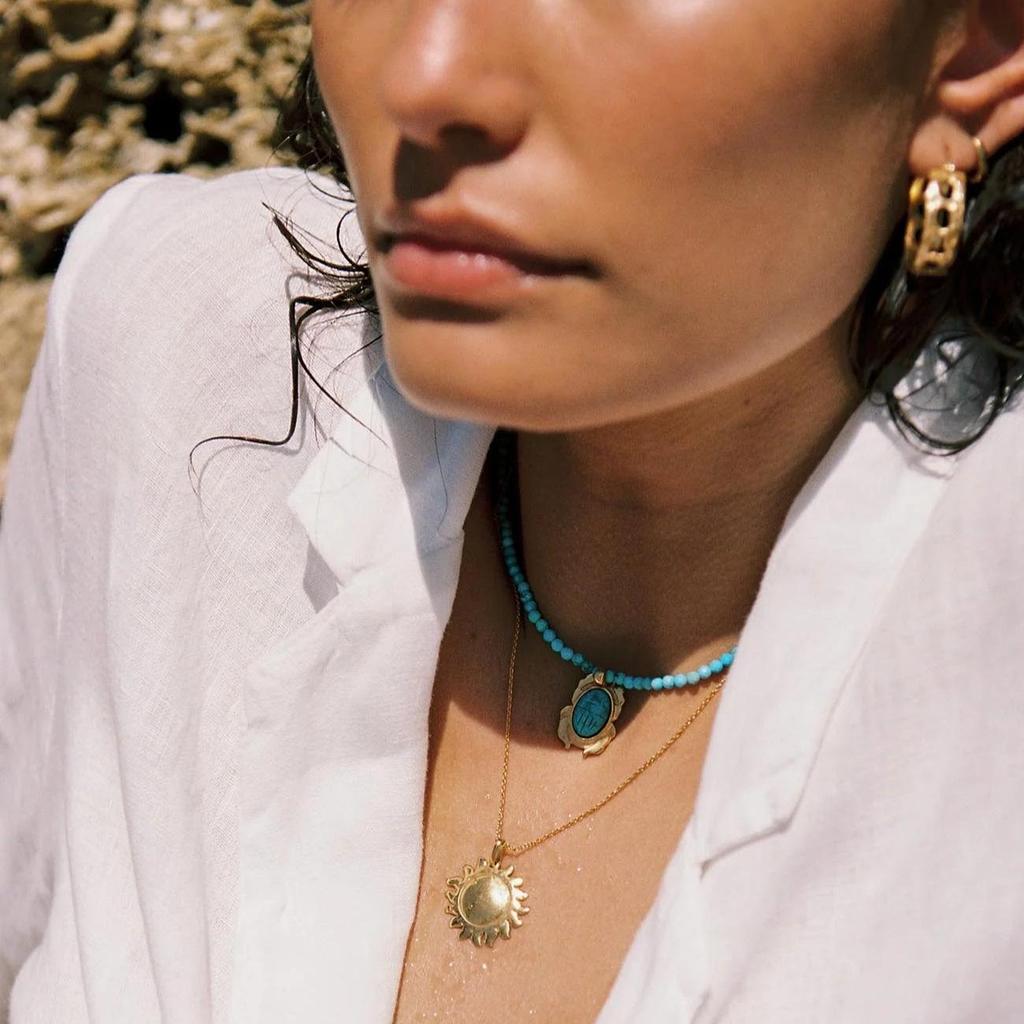 European-American 18K Gold-Plated Stainless Steel Necklace with Fish, Starfish, and Seashell Beads.