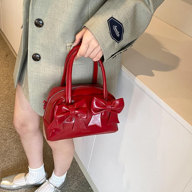 Niche simple bow handbag small bag women's texture pillow bag 2025 new fashion versatile messenger bag