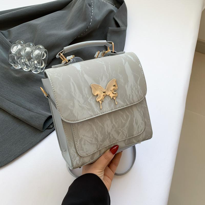 

Korean version of bow backpack solid color niche design aesthetic casual handbag 2024 new personalized shoulder bag срібний