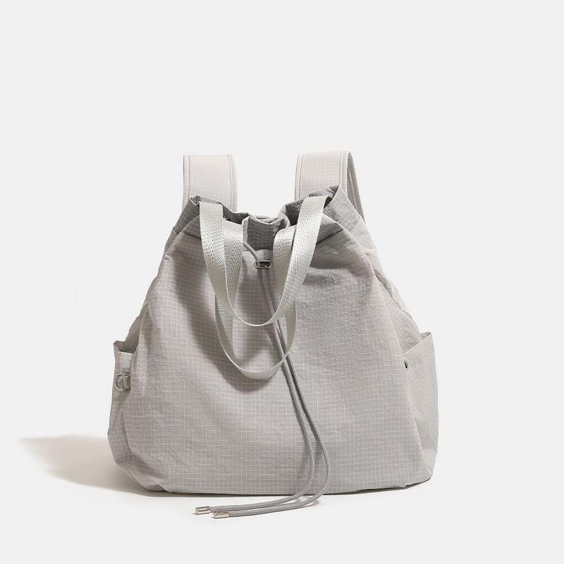 Simple, lightweight, casual nylon drawstring bucket bag, large-capacity backpack, women's commuter shoulder and crossbody bag