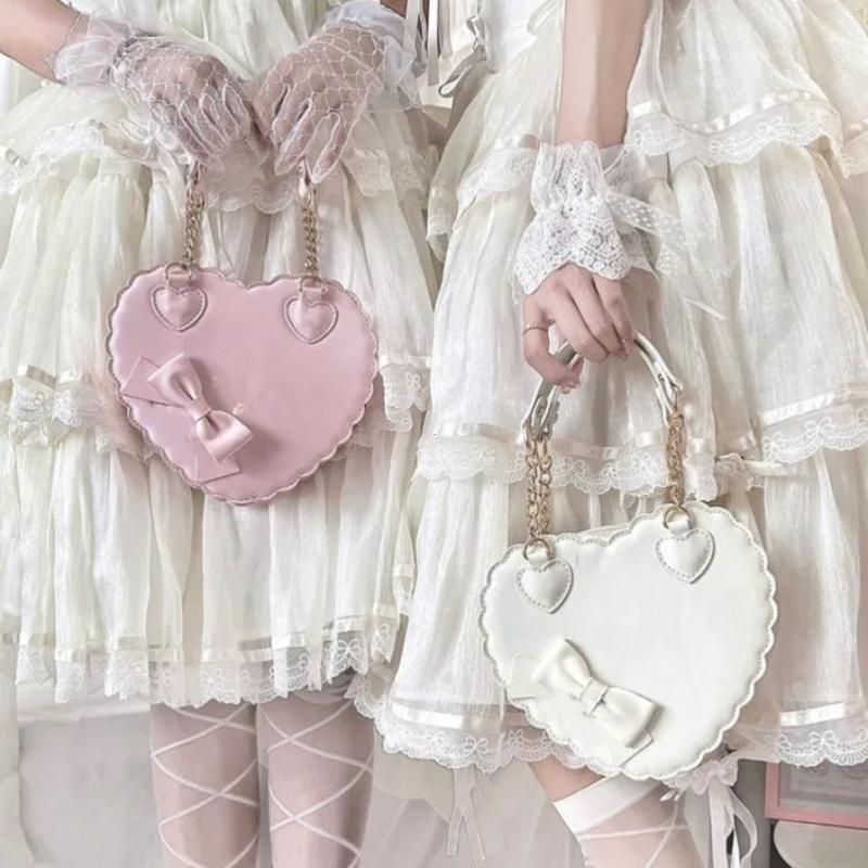 Sacs à main Lolita Cœur en PU Filles Nœuds Décoration Sacs à bandoulière japonais Deux tailles Portefeuilles Coquille Kawaii Sac bandoulière Rose Mignon Cadeaux