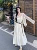 Seaside vacation style suit temperament waist suspender dress women's summer knitted hollow cardigan top two-piece set