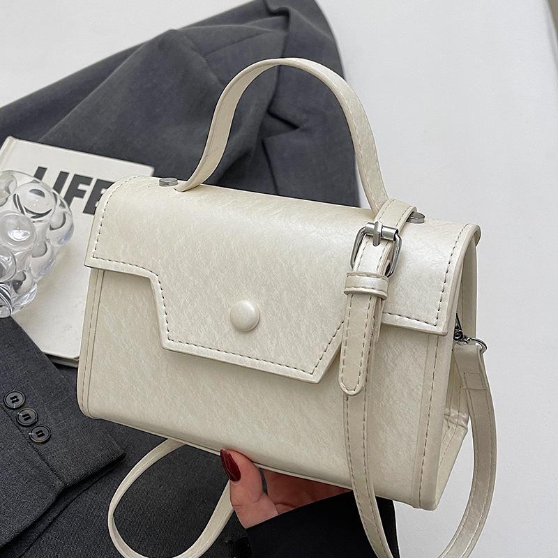 Wholesale new niche high-end sweet simple style solid color portable small square bag foreign style versatile commuter messenger bag