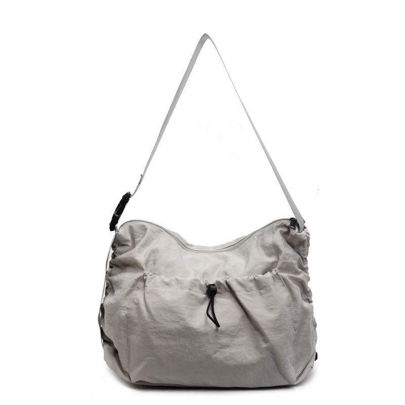 Lightweight messenger bag women's fashion large-capacity dumpling bag drawstring versatile shoulder bag college student class bag
