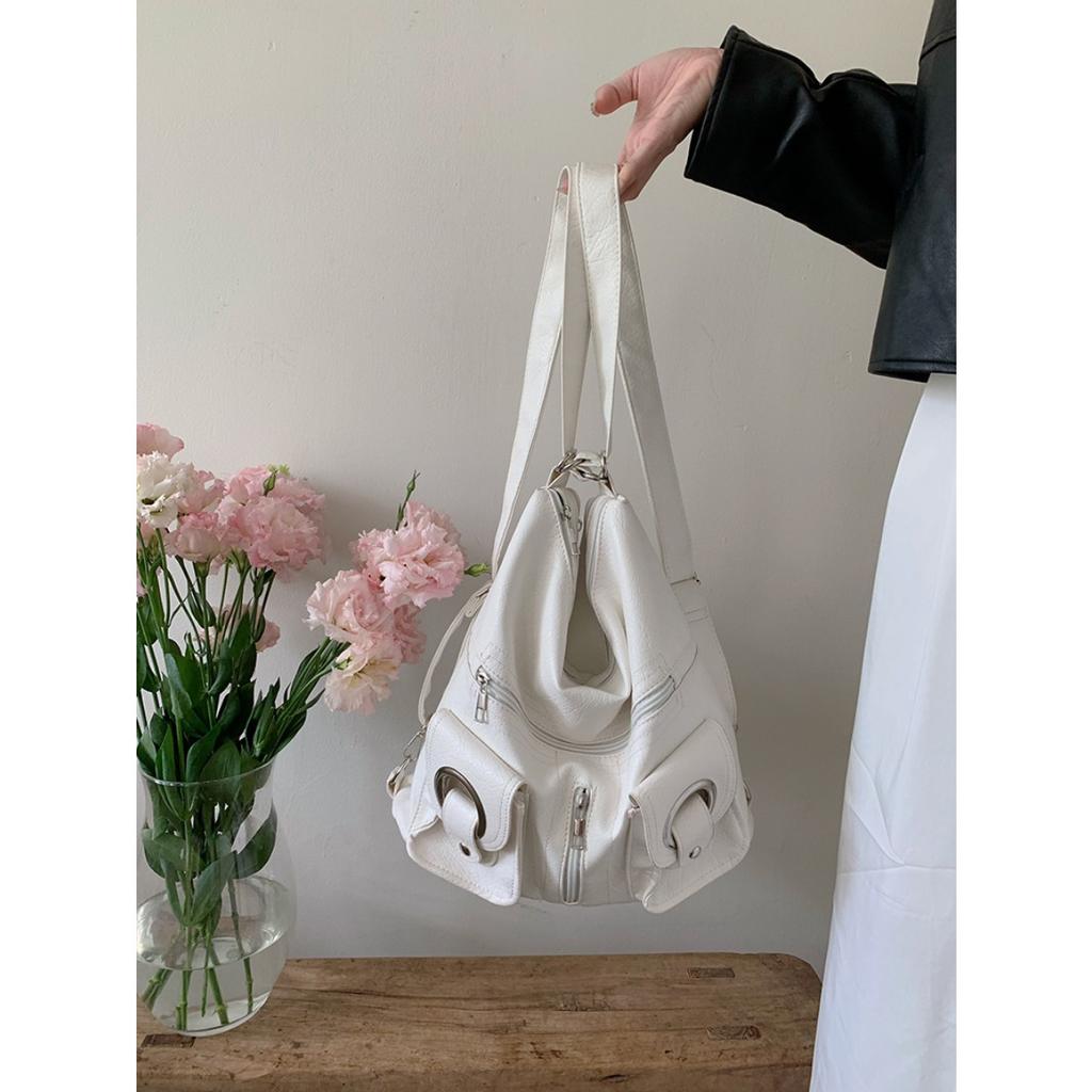 Koreanische Version Schlichte Persönlichkeit Vielseitig Modisch Reißverschlusstasche PU-Leder Tragetasche Schultertasche Pendeln Große Kapazität Rucksack