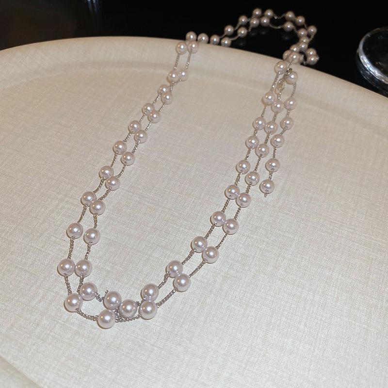 Artificial pearl beaded stacked necklace women's French retro autumn and winter sweater chain light luxury high-end dignified jewelry