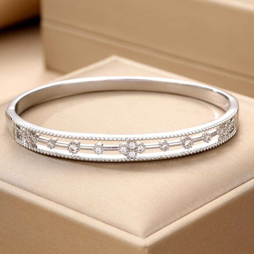 Luxurious hollow lace floral design inlaid with synthetic zirconium, copper open bangle with delicate beaded edges and carved patterns, a delicate