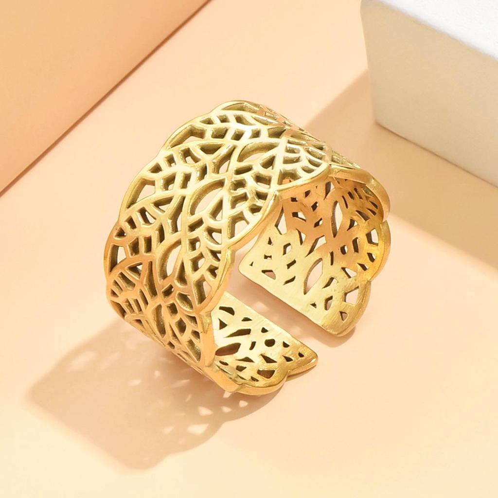 Elegant Hollowed Leaf Stainless Steel Ring: Artistic Retro Wide Band, Vacuum Gold Plated Jewelry for Women.
