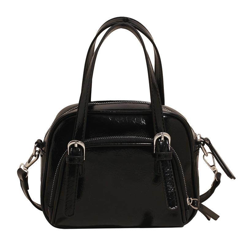 Spring and Summer New Korean Niche Ins Wind Oil Wax Leather Portable Pillow Bag Casual Versatile Commuter Wind Messenger Women's Bag