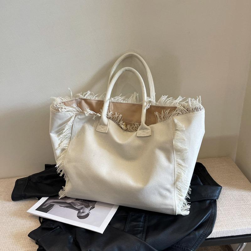 

Нишевый дизайн большая вместимость тоут бахрома сумка премиальная текстура холст сумка через плечо жёлтый