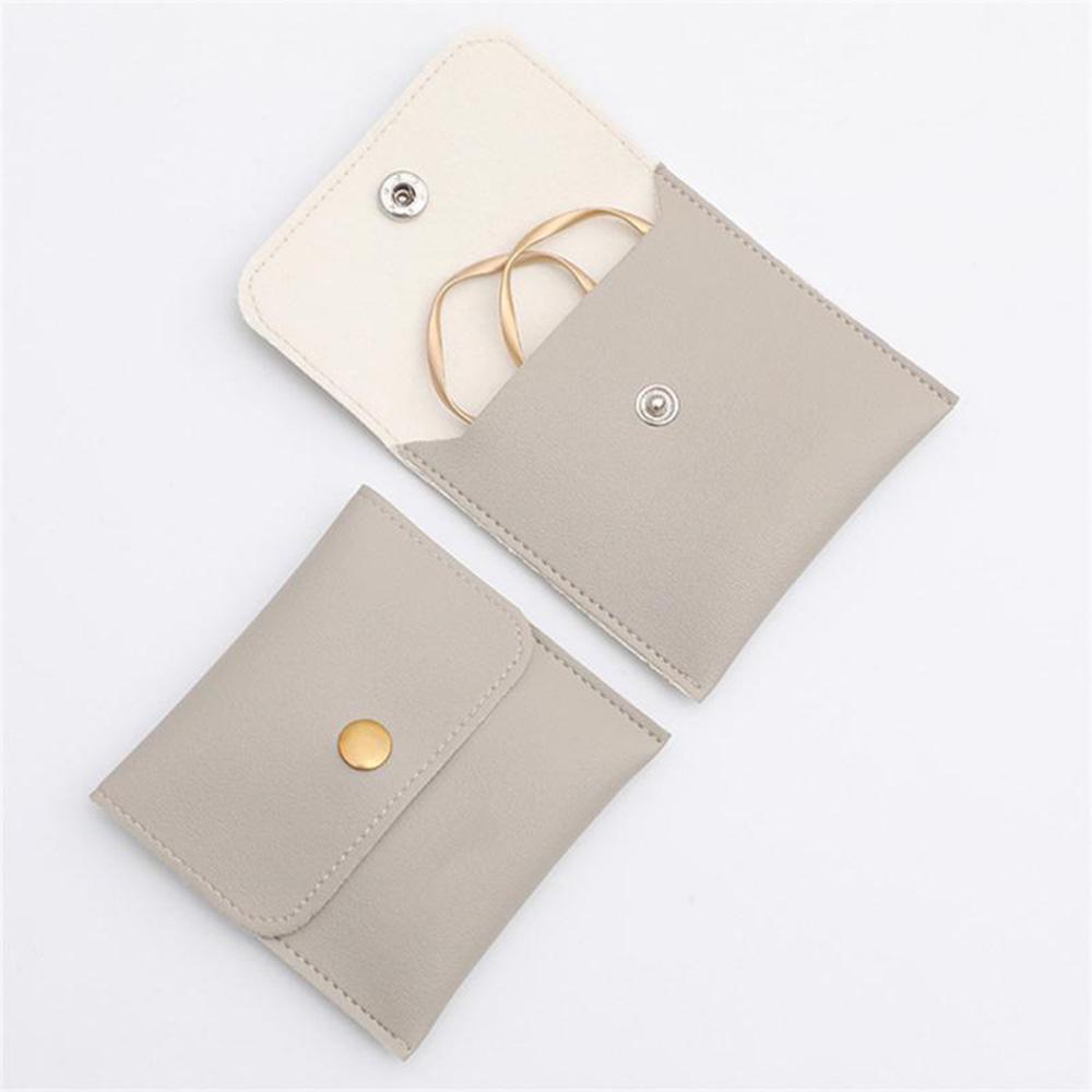 1 Stück PU Leder Schmuckverpackungsbeutel Halskette Ring Armband Ohrringe Organizer Aufbewahrung Druckknopf High End Mini Geschenk Schmuckbeutel KTY