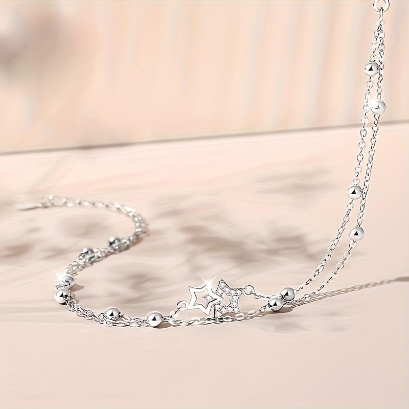 Bohemian-style double-layer leg bracelet with star-shaped pendant and synthetic zircon inlay, layered ankle jewelry suitable for daily wear