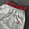 Evropské a americké retro sportovní ležérní volné pánské a dámské dvoupásové falešné dvoudílné tepláky