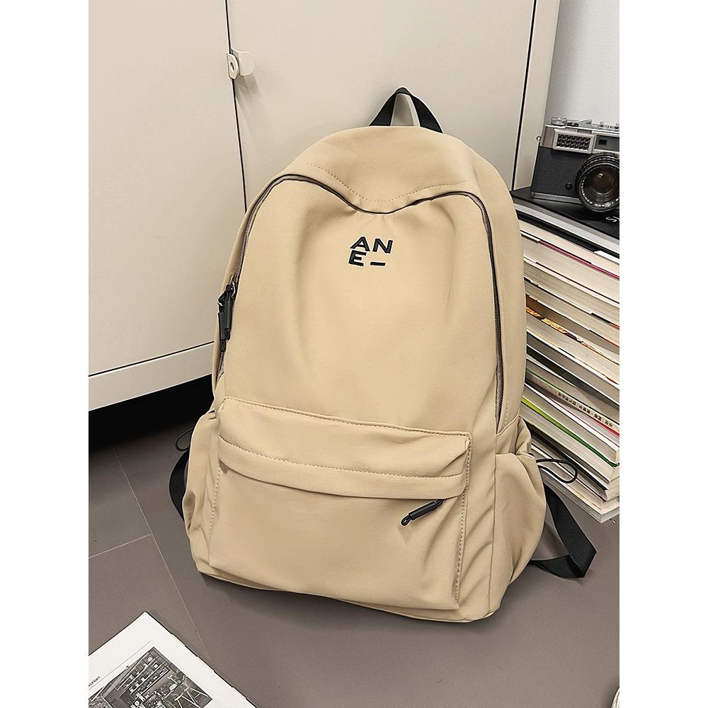 Korean version couple simple large-capacity backpack leisure commuter college student schoolbag niche light travel backpack women