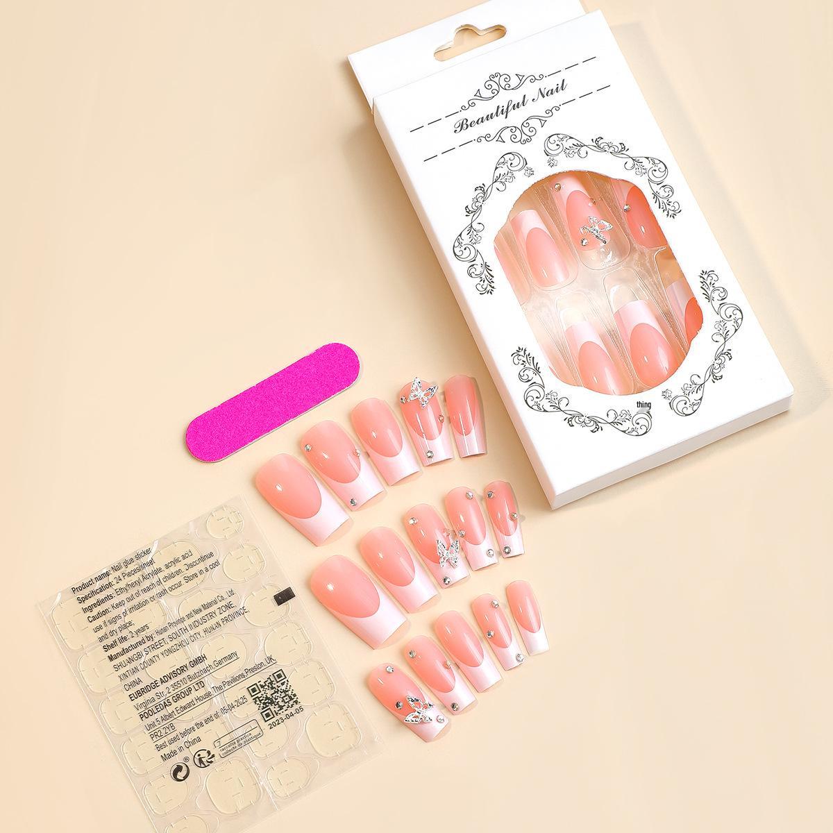 

Средне-длинные накладные ногти с французским кончиком и стразами в виде бабочек — Белые носибельные элементы нейл-арта