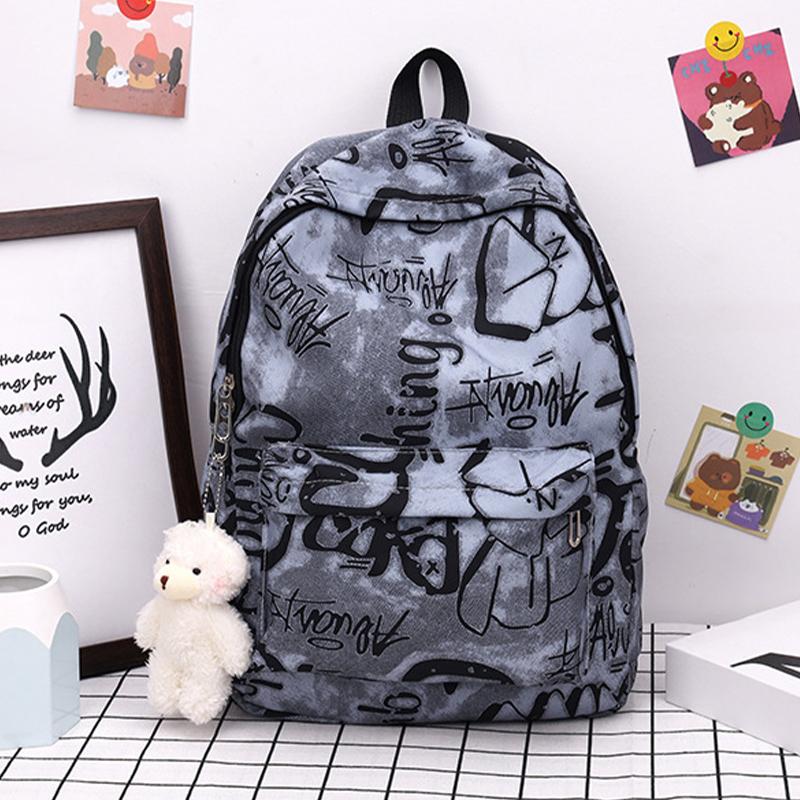 Nouveau Sac à Dos Scolaire Couple Lettres Graffiti Mode Loisirs Voyage Multifonctionnel
