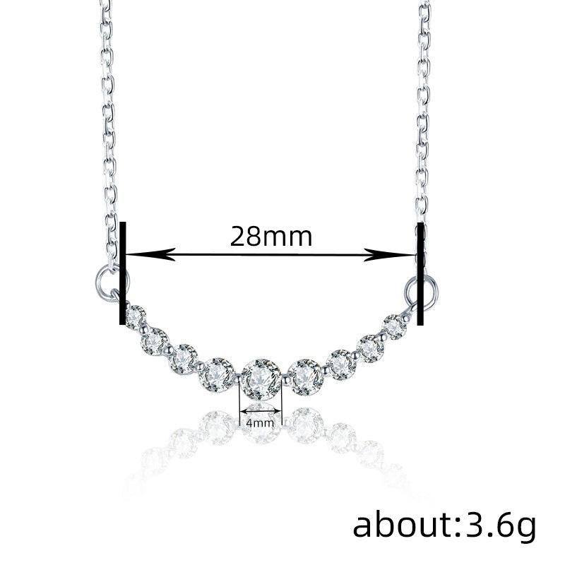 Curved smile pendant necklace, set with zircon stones