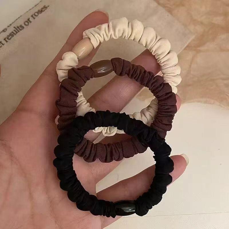 Versatile Black Elastic Hair Tie with Durable Leather Case