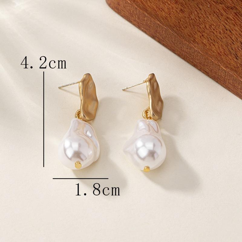 Meier Pearl earrings: minimalist, commute-ready style. elegant earrings for women, perfect for year-round wear