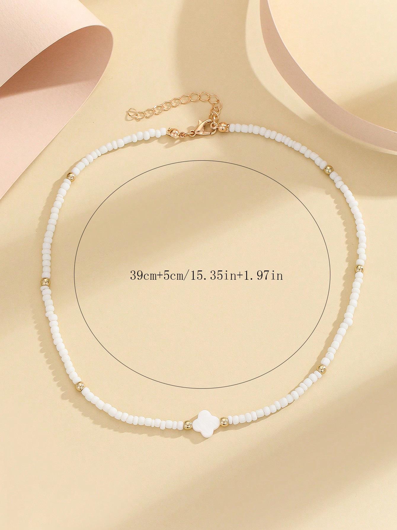 

Bohemian Four-Leaf Clover Pendant Necklace: Mother-of-Pearl Beaded Choker with Seed Beads