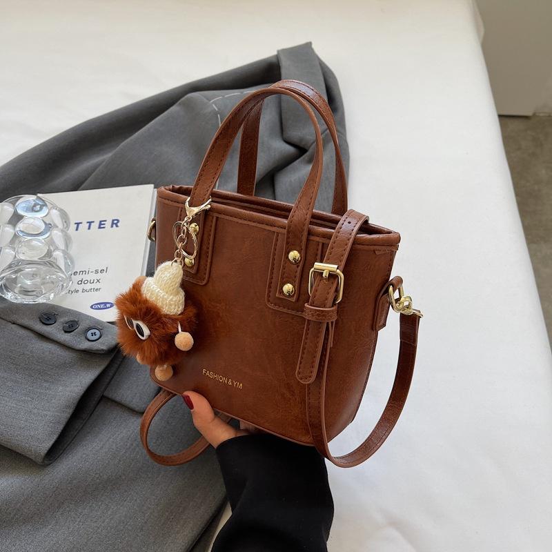 IELGY fashionable versatile shoulder messenger bag, textured explosive portable bucket bag