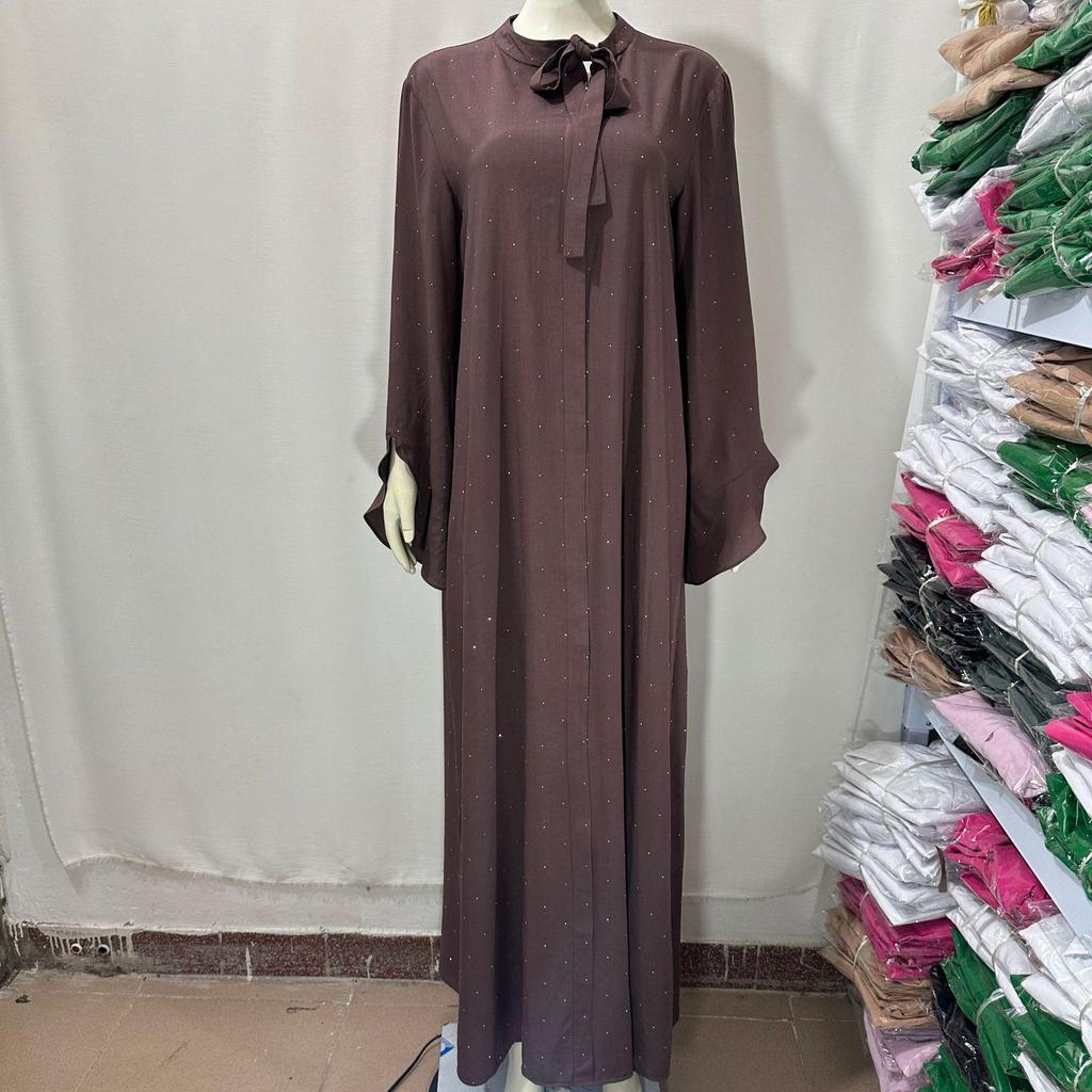 Glitzerndes Langarmkleid mit Rundhalsausschnitt und Bindedetail am Rücken