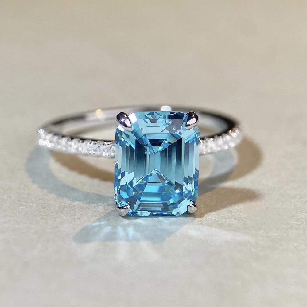 Aquamarine Emerald-Cut Ring In 925 Sterling Silver with Pave Diamonds, Plated In PT950 Gold.
