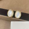 Elegant Retro White Oval Earrings - Luxurious & Versatile Studs with Unique Design Sensibility for a Modern, Minimalist Style.