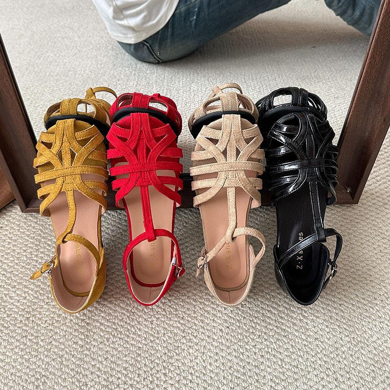 Woven flat-soled sandals women's summer retro outer wear hollowed-out baotou pig cage shoes one-button Roman shoes