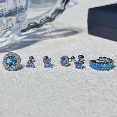 King Bomb Blue Zircon Spiral Ear Studs: Elegant, Versatile, Niche Design for Women.