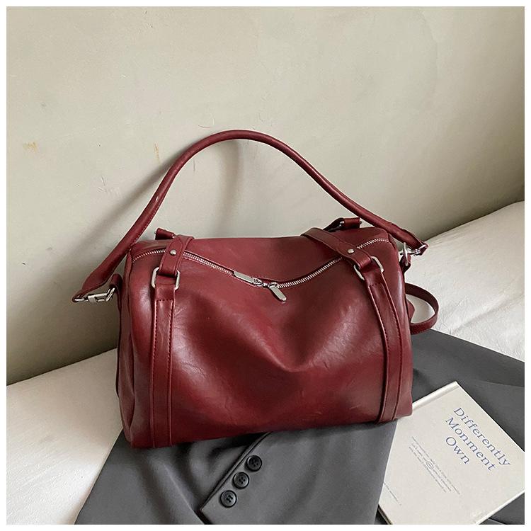 Eine stilvolle kleine Tasche für den Weg zur Arbeit, eine Umhängetasche mit großem Fassungsvermögen, eine modische Ein-Schulter-Tasche für Frauen