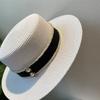 Spring and summer flat top top hat sticker straw woven big eaves hat seaside vacation straw hat sun protection beach hat French sun hat women