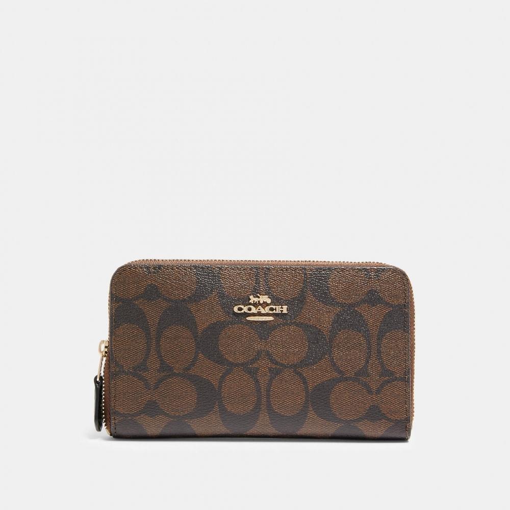 

Кошелек Coach среднего размера на молнии из канвы Signature