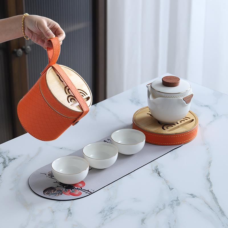 

One pot of three cups with small tea tray, camping travel ceramic hand-held pot, kung fu tea set, business gift.