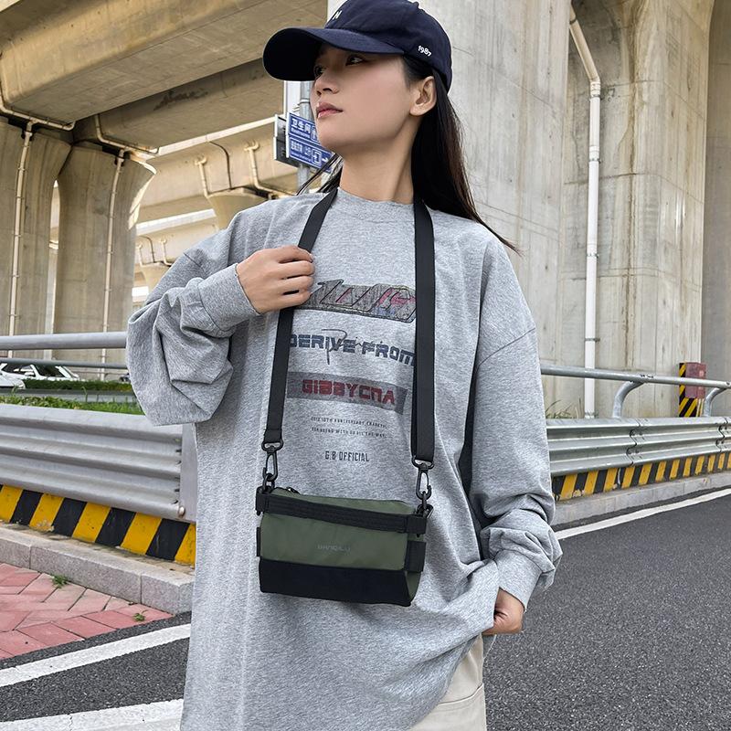 Pendler-Mode trendige Marke Reisetasche Umhängetasche Stiftehaltertasche Damen Koreanische Version tragbare Messenger Bag lässige Handytasche