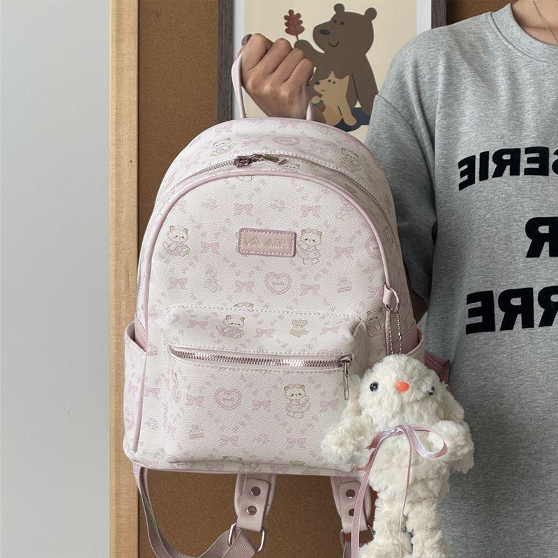 

Blue Bow Kitten Backpack: Versatile & Spacious Bag for the Sophisticated Woman