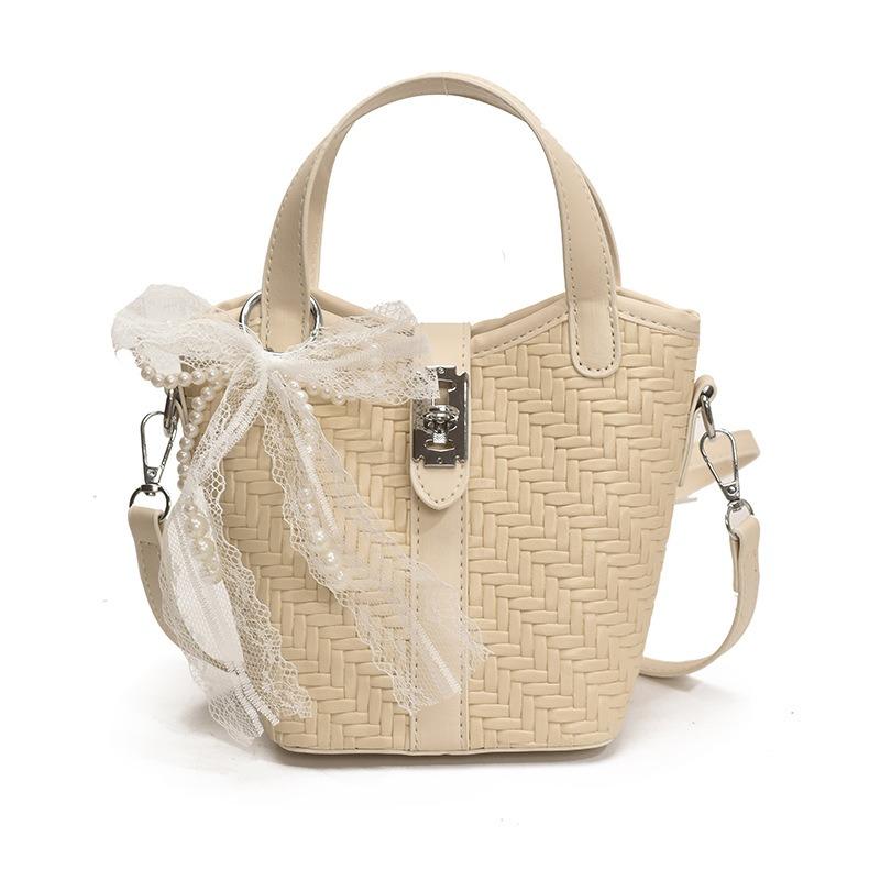 Nischendesign einfache und modische tragbare Bucket Bag Damen Sommer neue gewebte Schulter-Umhängetasche