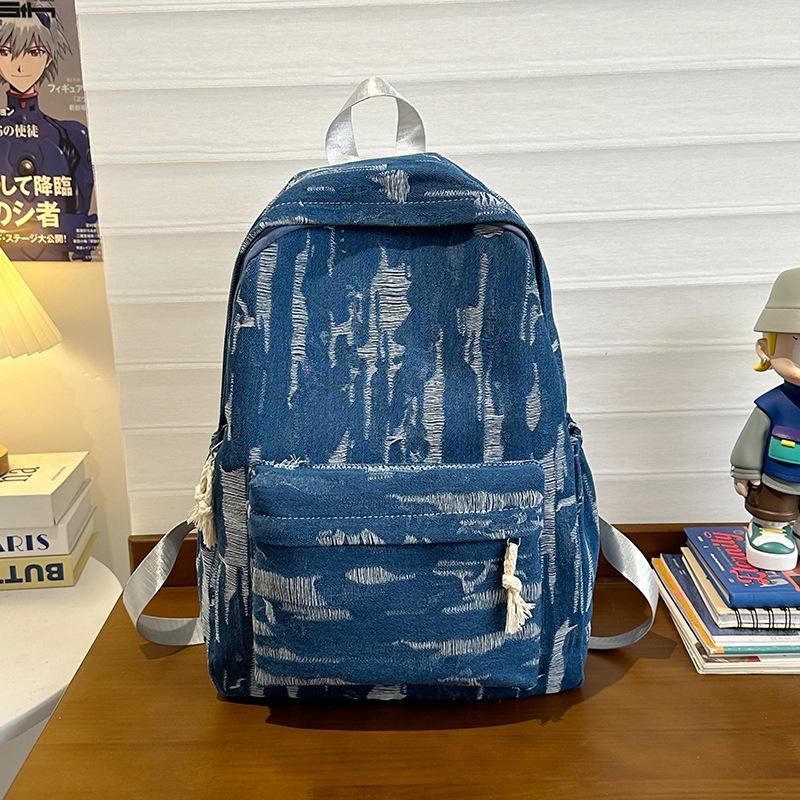 

Denim large capacity fashion trend backpack new niche art college style travel bag синій