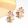 Sweet temperament small fresh drop glaze hollow flower leaf stud earrings light luxury niche high-end fairy earrings
