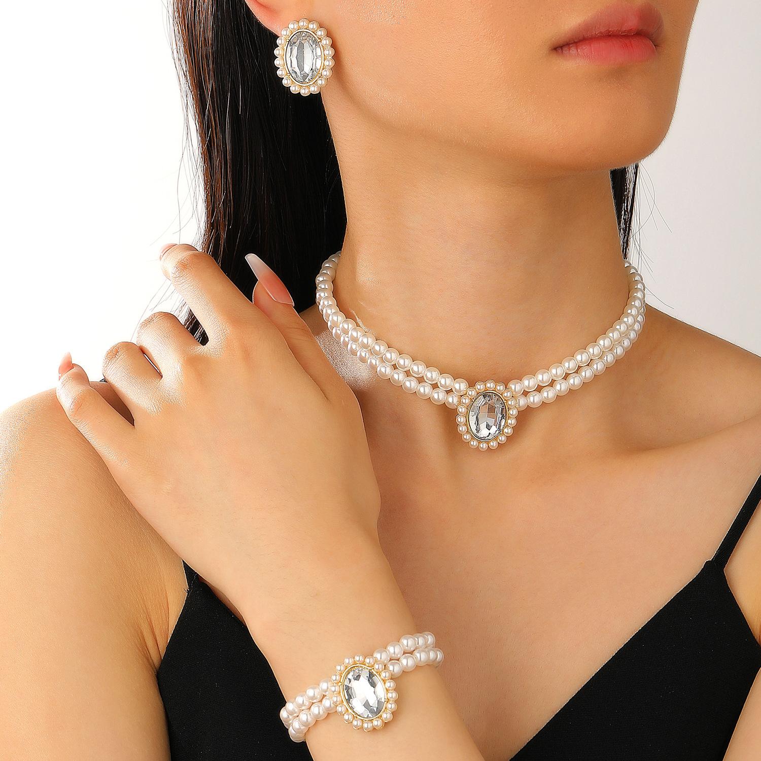 

2026 Foreign Trade High Quality Fashion Double Layer Imitation Pearl Oval Crystal Necklace Earrings Bracelet Three-piece Ornament