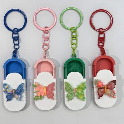 Přenosný pouzdro na pilulky s klíčenkou Mini organizér na pilulky Denní/Cestovní/Kancelářský box na léky Multifunkční malá úložná krabička
