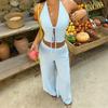 Conjunto de estilo de férias preguiçoso europeu e americano: Conjunto de duas peças com top cropped azul claro de amarrar no pescoço e calça pantalona de cintura alta