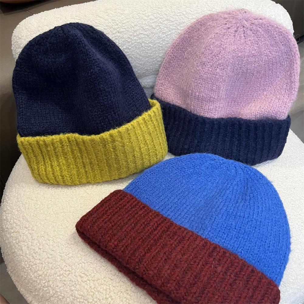 Simple two-color splicing wool hat women's autumn and winter warm niche versatile ear protection hat large version knitted pullover hat tide