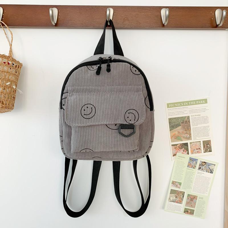 Mini backpack cute smiley face versatile small cosmetic bag corduroy student schoolbag