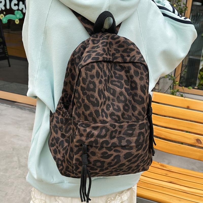Leopard Print Backpack Casual Daily Use Trendy Street Style Lightweight Backpack for Women with Tassel Detail for School Travel and Everyday Outings