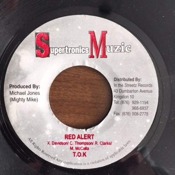 

7-дюймовая пластинка T.O.K. - Красная тревога НИКАКОЙ Supertronics Mu 2003 Ямайский регги, ска и даб Б/У