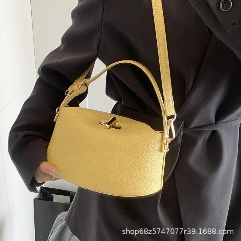 2025 new solid color temperament handbag large-capacity women's bag niche casual one-shoulder real high-end messenger bag