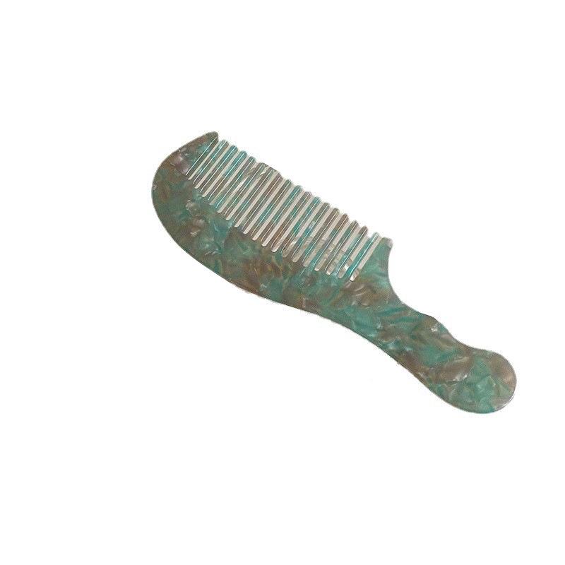 Elegant and compact tortoise shell acetate hair comb for easy portability.