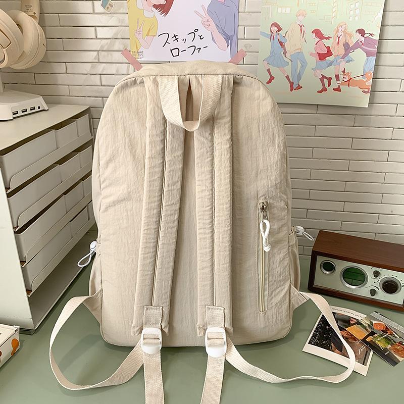 School bag solid color high-end female simple large school bag lightweight high school large capacity couple travel backpack